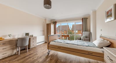 A well-furnished resident room with a view