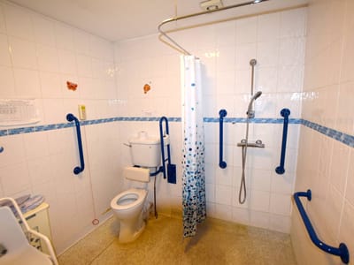 Accessible bathroom with safety features and ample space