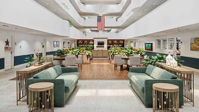 Bright common area with seating and plants