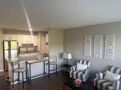 Bright interior view of a living area with kitchen