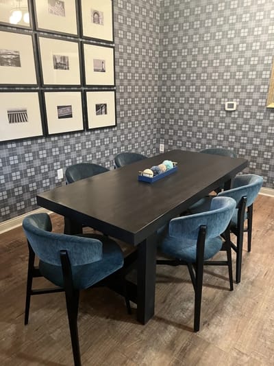 Dining area with a long table and chairs