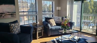 Cozy common area with comfortable seating and flowers