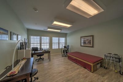 Interior room with therapy equipment and office space