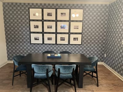 Interior common area with seating and framed pictures