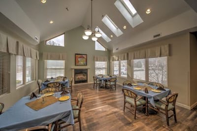 Dining room with tables set and large windows
