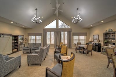 Bright common area with seating and large windows
