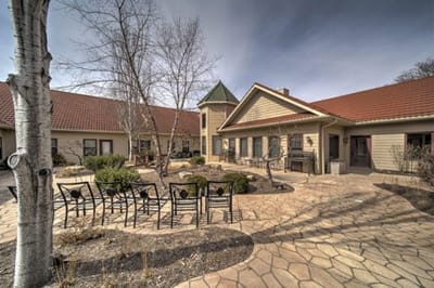Outdoor courtyard with seating area and trees