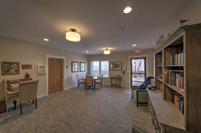 Bright common area with seating and bookshelves
