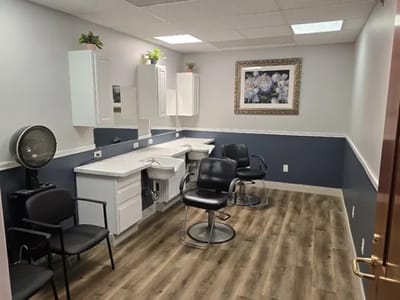 Interior view of a salon area with styling chairs