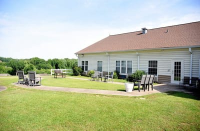Outdoor seating area with a view of the facility