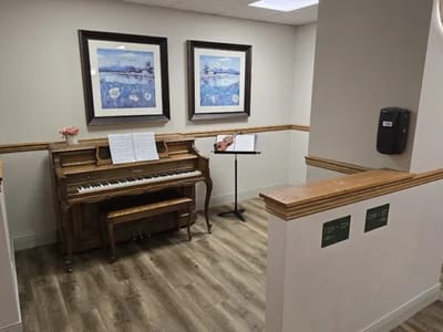 Interior corner of a common area with piano