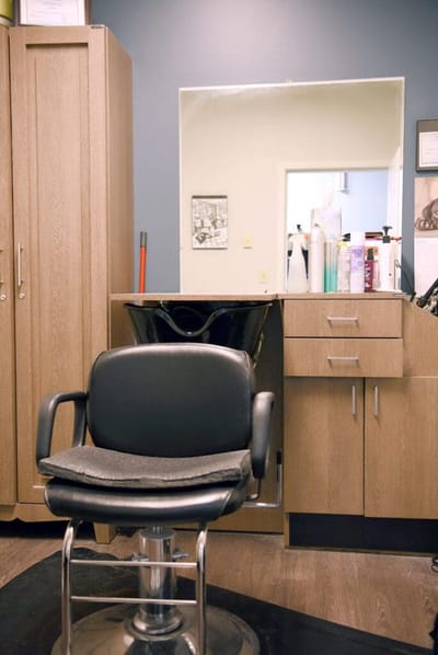Interior view of a hair salon with a stylist chair