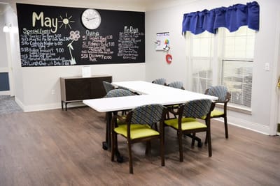 Bright activity room with a calendar of events