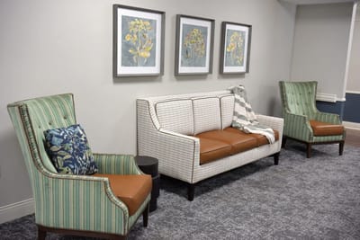 Cozy common area with seating and wall art
