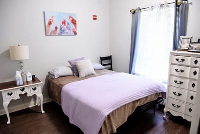 Cozy interior of a resident's room with a bed and decor