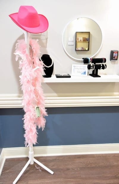 Interior decoration with a pink hat and boas