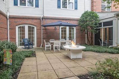 Outdoor patio area with seating and umbrella