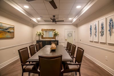 Bright, modern interior of a meeting room with chairs and art
