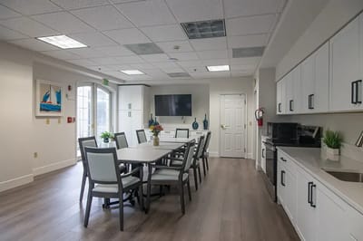 Bright common area with tables and chairs