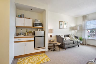 Cozy interior of a resident's room with kitchenette