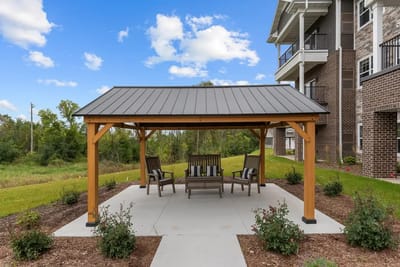 Outdoor gazebo with seating near the facility