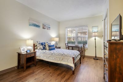 A well-furnished private room in a senior living facility