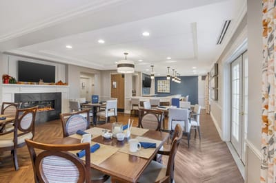 Cozy dining area with tables and chairs
