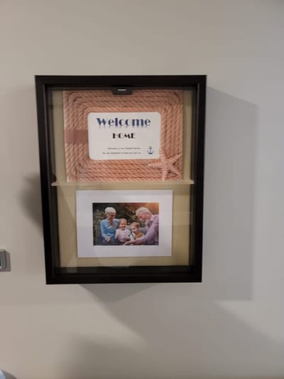 Welcome home display with family photo.