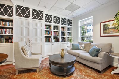 Cozy common area with bookshelves and seating