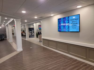 Bright interior corridor with digital signage