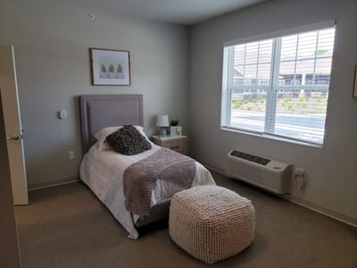 Cozy private bedroom in a senior living facility