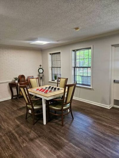 A cozy common area with checkers game table