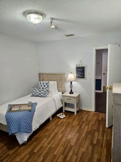 Cozy private room with bed and decor