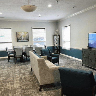 Bright common area with seating and dining tables
