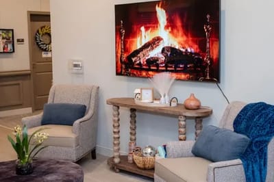 Cozy lounge area with fireplace and seating