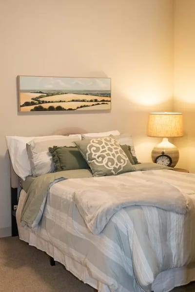 Cozy resident bedroom with soft tones and decor