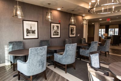 Cozy common area with modern chairs and tables