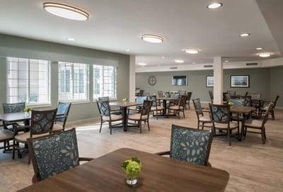 Bright dining area with tables and chairs