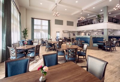 Bright dining area with tables and chairs