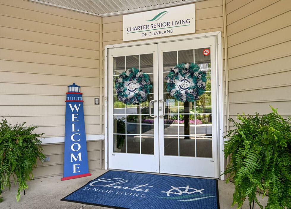 Entrance of Charter Senior Living with welcome decor