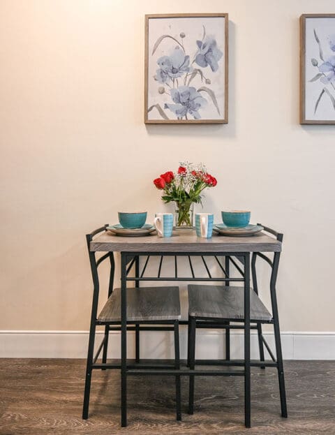 Cozy dining setup with flowers and tableware