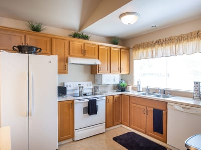 Bright kitchen interior with wooden cabinets