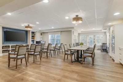 Bright common area with tables and chairs