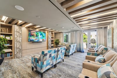 Bright common area with seating and entertainment space