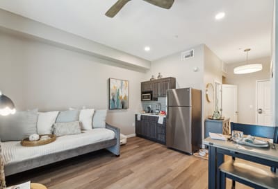 Cozy resident room with kitchenette and decor