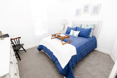 Cozy bedroom with blue bedding and decor