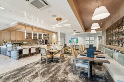 Dining area with tables and chairs in a modern interior