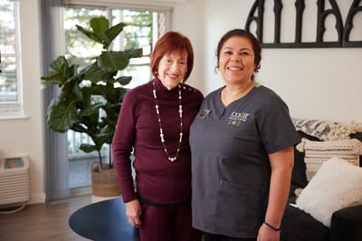 Staff member with resident in a cozy living area