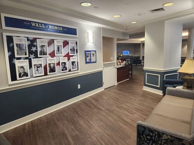 Common area featuring a Wall of Honor and seating