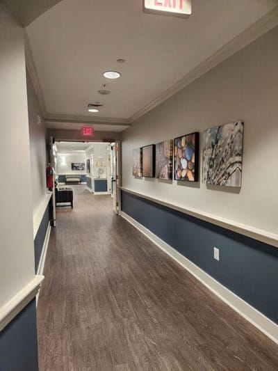 Interior hallway with artwork on the walls